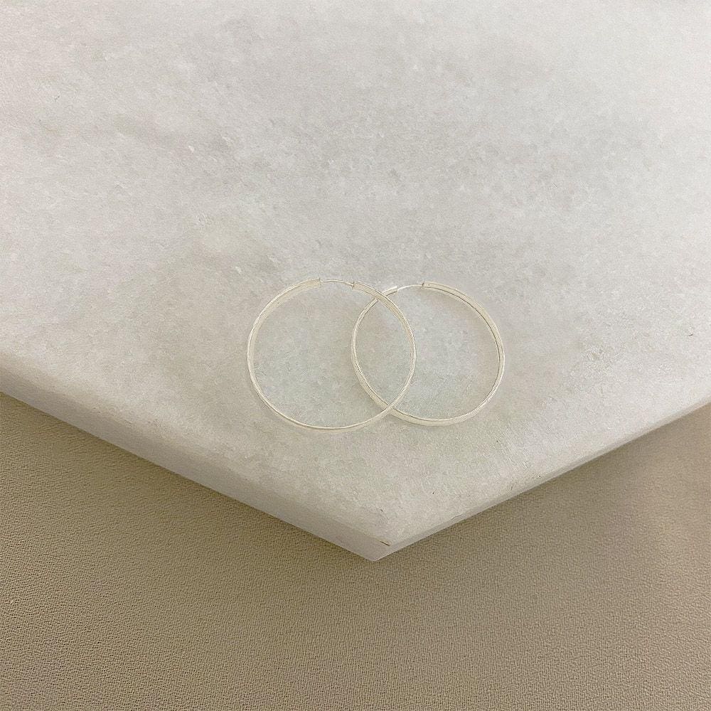 Brinco Argola com acabamento Arredondado