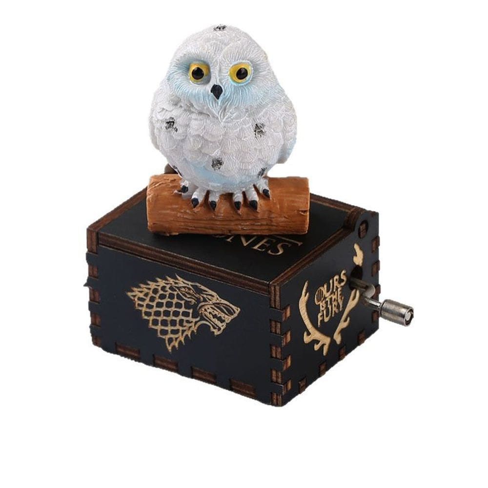 Caixa de música, manivela de madeira com estatueta de coruja e emblema de lobo