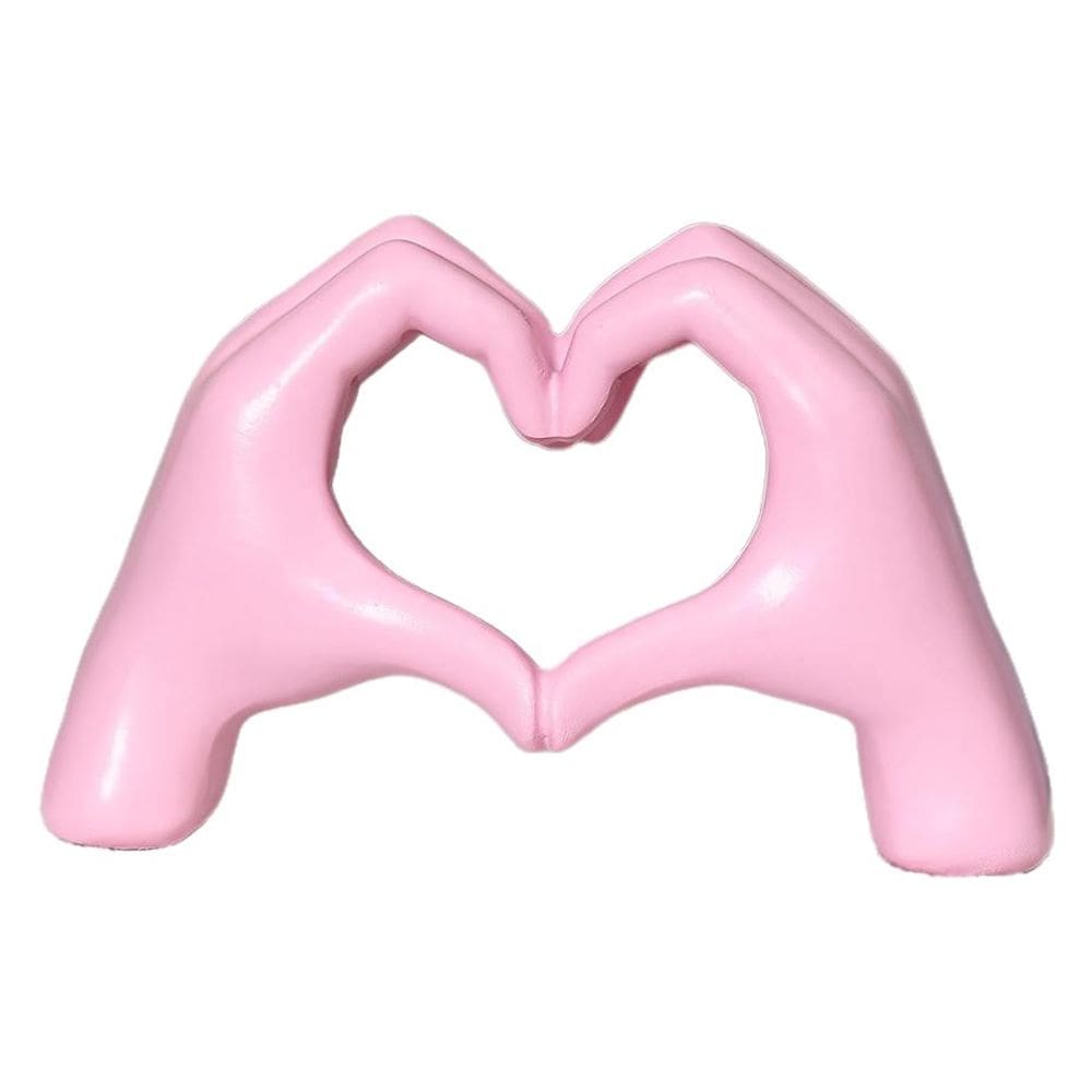 Escultura: resina rosa, coração, mãos, gesto criativo de amor