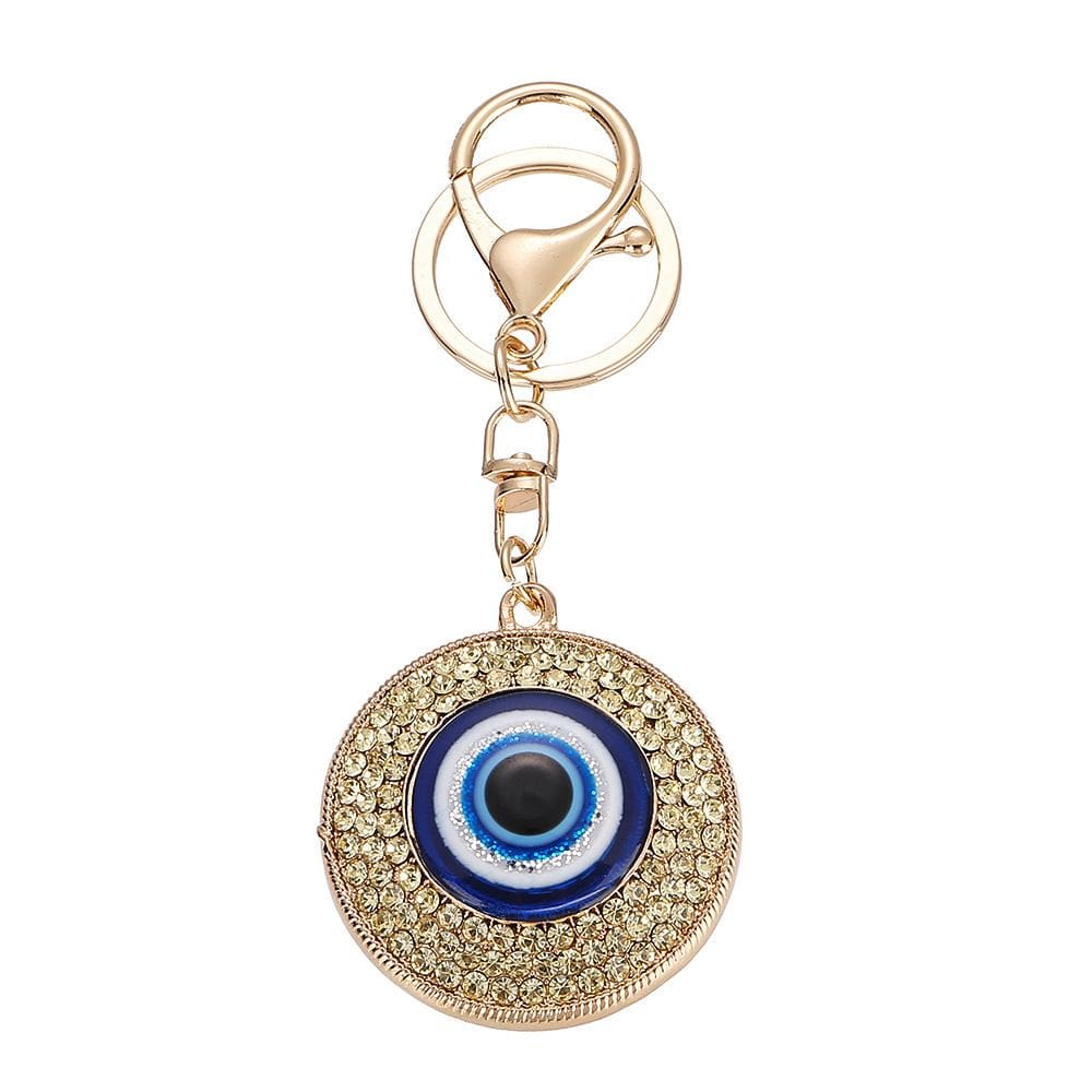 Chaveiro Evil Eye azul e dourado de cristal metálico 5x5cm