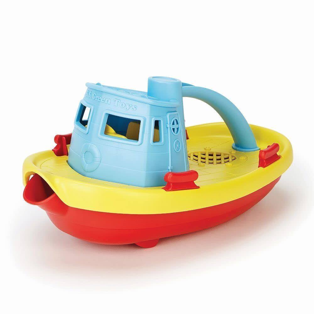 Tugboat Green Toys, enchendo e flutuando com água azul
